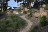 gravel path echoes the landscaping rock elements