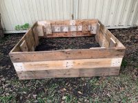Finished raised garden bed from recycled pallet wood